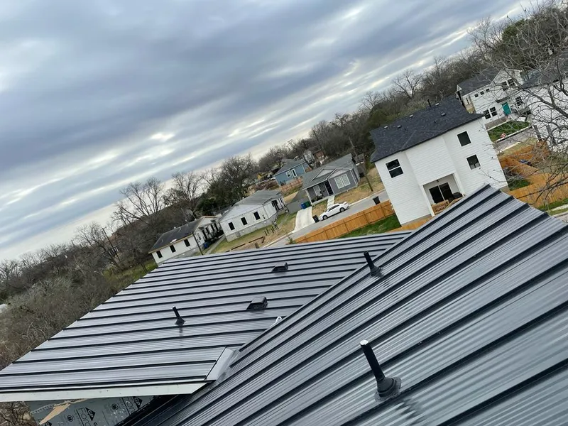 Standing seam metal roof panels with vents for Skylight Repair in Moline